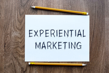 Experiential Marketing - written on paper pencil on table